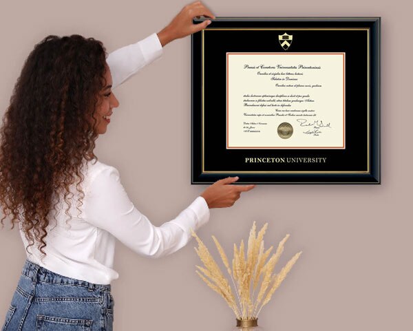 woman hanging a diploma